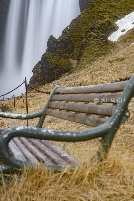 bench at the Skógafoss waterfall in southern Iceland. It is one of the largest waterfalls in the country